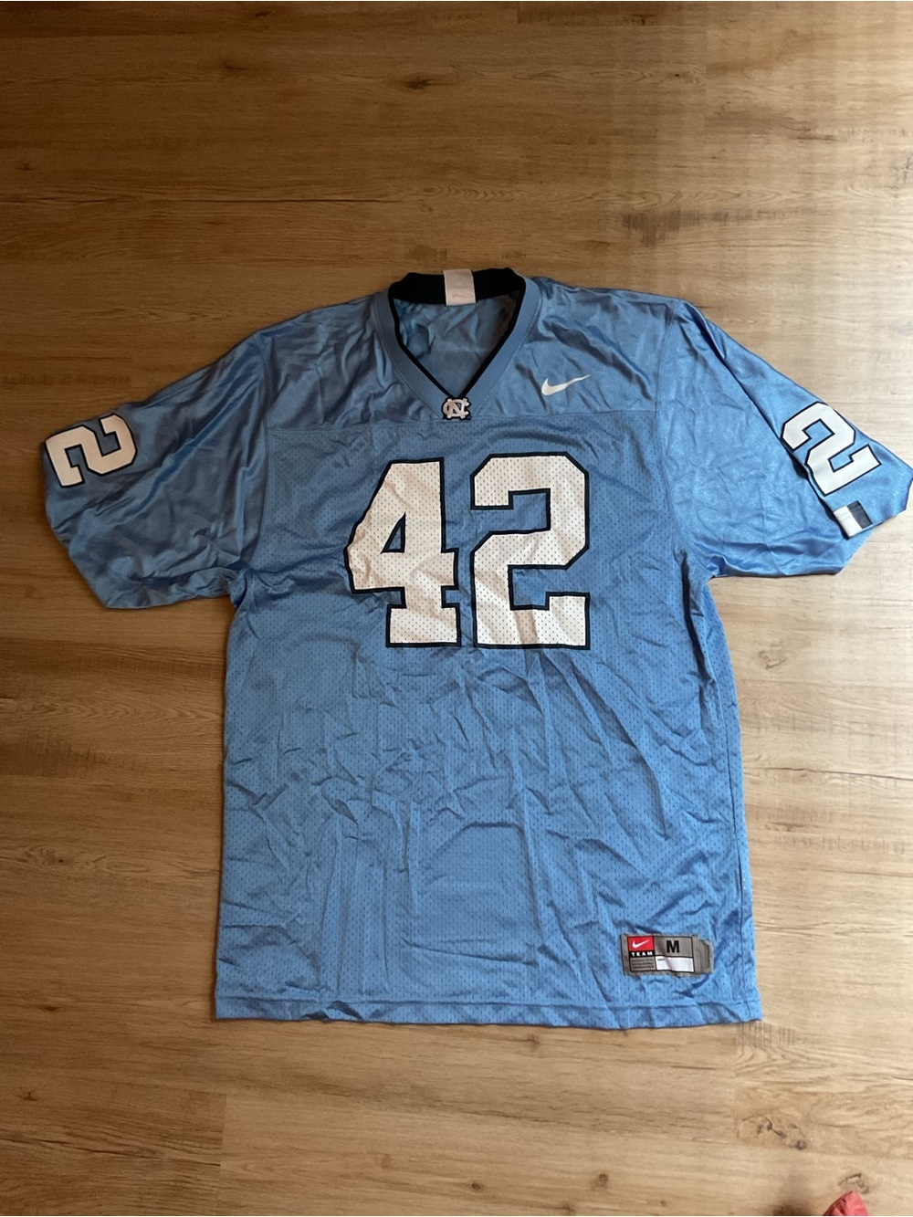 Nike Carolina Blue Football Jersey with White Number 42